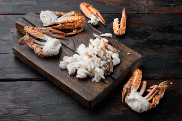 Boiled Blue swimmer crab meat or Horse Blue crab, Flower crab, on wooden cutting board, on dark wooden background - obrazy, fototapety, plakaty