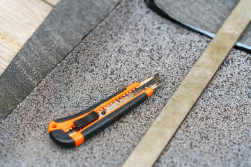 roofing felt with cutting tool
