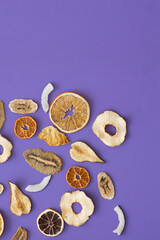 Useful vitamins in dried fruits on the background