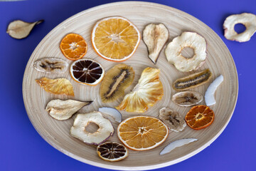 Healthy vitamins in dried fruits Diet food Wooden plate for food on the background