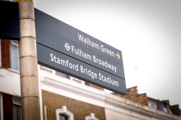 London- Directional street sign in west London for  Chelsea FC's Stanford Bridge Stadium and Fulham...