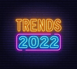 Fototapeta na wymiar Trends 2022 neon sign on brick wall background.