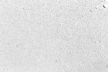 water droplets on glass for background.
