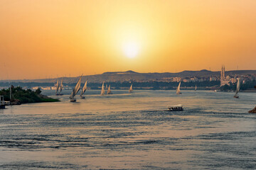 View of a beautiful orange sunset in Aswan, Egypt - obrazy, fototapety, plakaty