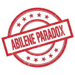 ABILENE PARADOX text written on red vintage round stamp.