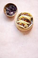 Bao bun in bamboo steamer 