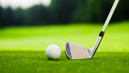 Golf club and ball on the golf course