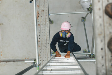 Male climb the stairway storage visual inspection tank