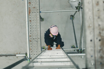 Male climb the stairway storage visual inspection tank