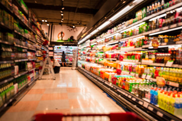 Defocused blur put on the at alcohol drink products in supermarket