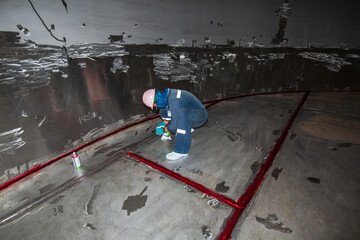Male into work inspection process chemical color paint  weld red at the with stainless steel tanks