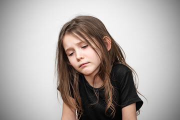Sad child in depression. Upset girl in a bad mood.