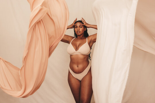 Curvy young woman posing in underwear