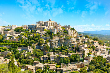 View on Gordes, a small typical town in Provence, France. Beautiful french village, with view on roof and landscape on sunny summer day