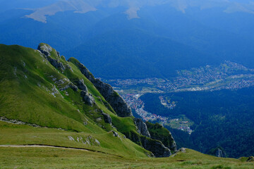Fototapeta premium Beautiful view of Caraiman Peak and Busteni city in Bucegi mountains, Prahova, Romania