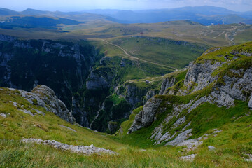 Fototapeta na wymiar Beautiful nature landscape on the mountain trail to Caraiman Peak in Bucegi mountains, Carpathians, Prahova, Romania