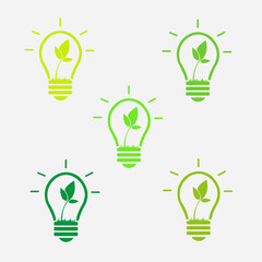 A set of light bulbs, different colors. Nature, ecology, energy icons. A lamp inside which a flower grows. Yellow, green lamp. Light bulb sign