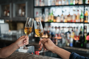 closeup hand of man holding glass of champagne