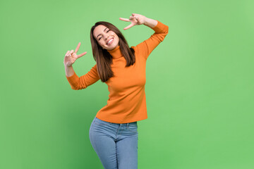 Portrait of attractive cheerful carefree girl having fun showing v-sign good mood isolated over...