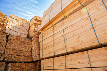 Wooden boards, lumber, industrial wood, timber. Pine wood timber stacked at the port site 