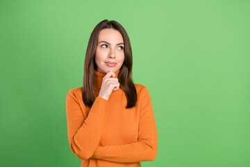 Photo portrait woman smiling thoughtful touching chin looking copyspace isolated pastel green color background