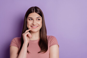 Fototapeta premium Close up photo of nice attractive girl happy positive smile finger touch chin look empty space isolated over violet color background