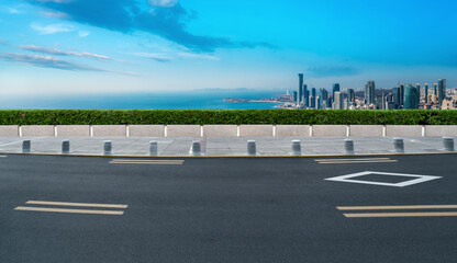 Fototapeta premium Road and city buildings background