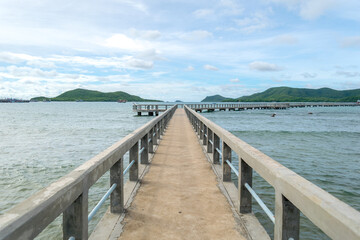 the wooden bridge pier between clearly sky at Pattaya, Thailand