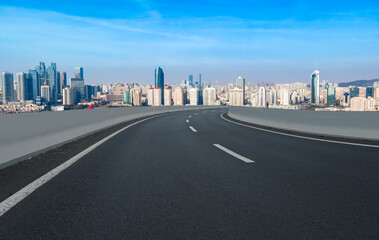 Fototapeta premium Road and city buildings background