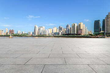 Square floor tiles and city buildings background