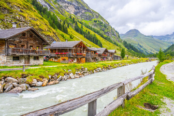 Fototapeta na wymiar Old rural wooden houses in Innergschlos village, Gschlosstal Valley in Hohe Tauern National Park, East Tyrol, Austrian Alps