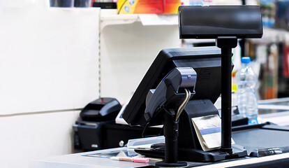 Cash desk with terminal in supermarket - obrazy, fototapety, plakaty