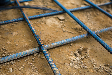 Reinforcement steel rod and deformed bar with rebar at construction site.