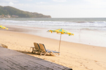 Fototapeta na wymiar Umbrellas on beach and Coconut palm trees in islands.Blue sea waves and sky on sand famous beach.