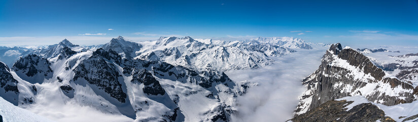 Naklejka premium Switzerland, Panoramic view on Snow Alps and Blue Sky around Titlis mountain