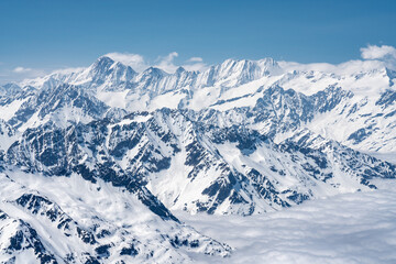Fototapeta premium Switzerland, Panoramic view on Snow Alps and Blue Sky around Titlis mountain