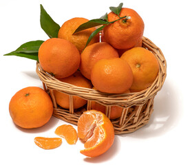 Fresh Mandarin orange fruits, tangerine, yellow-orange clementine with green leaves