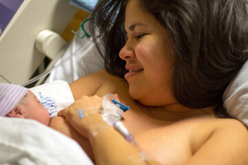 Laid directly on the mother's bare chest after birth, Skin to skin