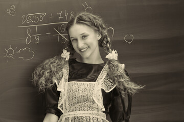 Retro shot of joyful school girl in uniform