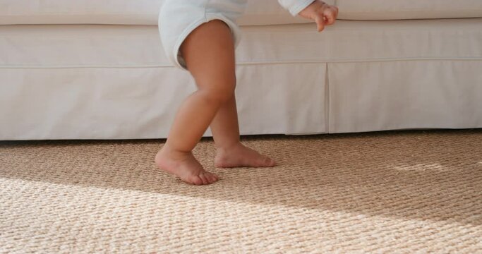 cute baby learning to walk happy toddler having fun taking first steps walking enjoying childhood curiosity at home 4k