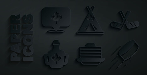 Set Stack of pancakes, Ice hockey sticks, Bottle maple syrup, Hockey puck, Indian teepee or wigwam and Canadian leaf icon. Vector © Kostiantyn