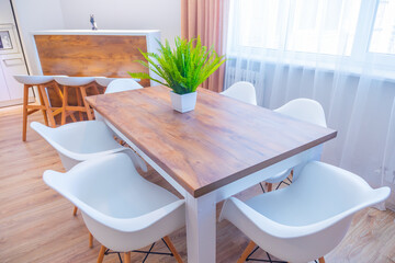 Wooden table with chairs. Modern interior design