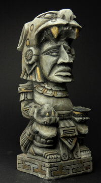 mayan figure from the front on black background