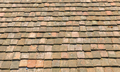 Installation of old roof tiles.