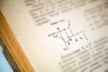 Old Russian chemistry book open on page with chemical formula of Penicillin
