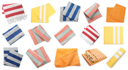 Set with different beach towels on white background