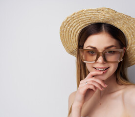 pretty woman in hat with drink in hands fashion sunglasses studio