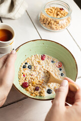 Healthy breakfast with muesli with milk and fruits