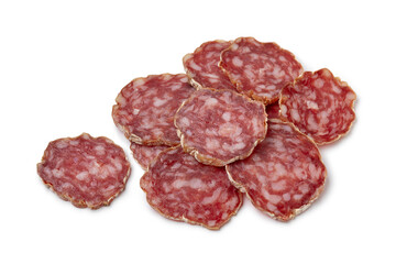 Heap of sliced Rosette de Lyon, a French pork saucisson close up isolated on white background 