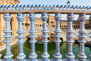 Fototapeta premium Close-up of a ceramic decoration on a bridge at Plaza de Espagna (meaning: Spain square) in Seville, Andalucia, Spain.